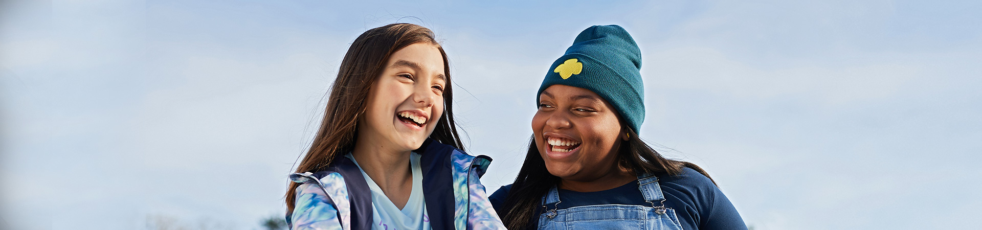  group of young girl scouts outside cheering 